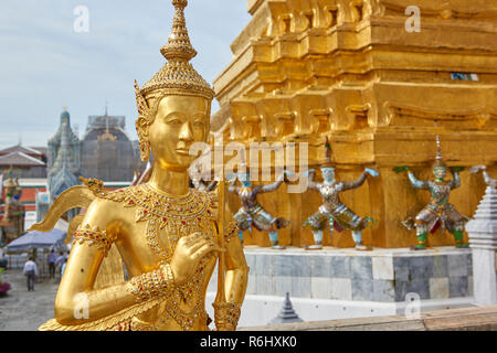 Golden dancer statues inside the Grand Palace in Bangkok, Thailand. Stock Photo