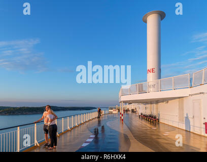 Couple on the deck of the Turku to Stockholm ferry showing the Norsepower Rotor Sail, Turku Archipelago, Finland Stock Photo