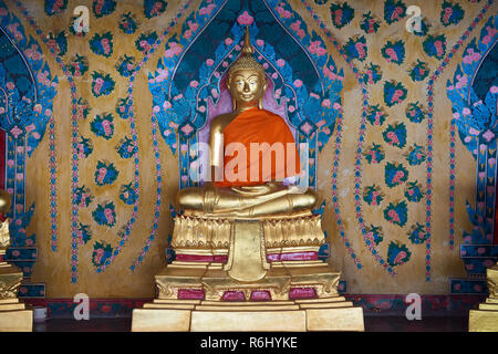 One of the several golden Buddha statue under the cover of one of the Ordination Hall in Bangkok, Thailand. Stock Photo