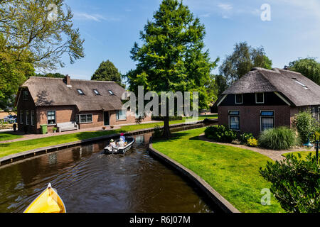 Giethoorn, Netherlands - July 4, 2018: view of famous village Giethoorn with canals in the Netherlands. Giethoorn is also called 'Venice of The Nether Stock Photo