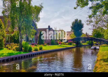 Giethoorn, Netherlands - July 4, 2018: view of famous village Giethoorn with canals in the Netherlands. Giethoorn is also called 'Venice of The Nether Stock Photo