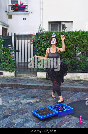 PARIS - September 08: Mime dancing with a magic ball on the head in Montmartre, Paris, France. on September 08 2013. Montmartre area is among most pop Stock Photo