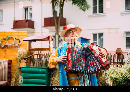 Vetka, Belarus - June 23, 2018: Man In Ethnic Traditional Folks National Belarusian Costume Plays The Accordion Folk Belorussian Music Stock Photo