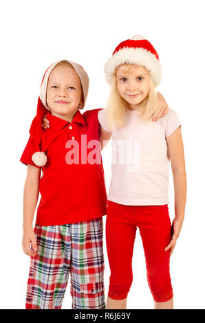 boy and girl in christmas hats Stock Photo