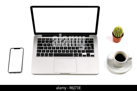 Top view of laptop withs blank screen martphone, cup of coffee, and cactus, isolated on white background. High quality. Stock Photo