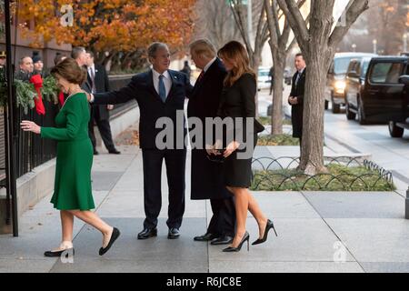 Washington DC, USA. 4th December, 2018. Former U.S. President George W. Bush, center, welcomes U.S President Donald Trump and First Lady Melania Trump to Blair House as former First Lady Laura Bush walks ahead December 4, 2018 in Washington, DC. Bush is staying at Blair House to attend the memorial service for his father the late President George H.W. Bush. Credit: Planetpix/Alamy Live News Stock Photo