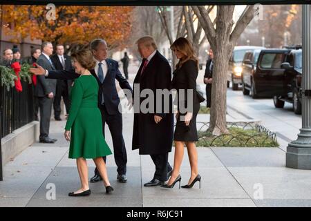 Washington DC, USA. 4th December, 2018. Former U.S. President George W. Bush, center, welcomes U.S President Donald Trump and First Lady Melania Trump to Blair House as former First Lady Laura Bush walks ahead December 4, 2018 in Washington, DC. Bush is staying at Blair House to attend the memorial service for his father the late President George H.W. Bush. Credit: Planetpix/Alamy Live News Stock Photo