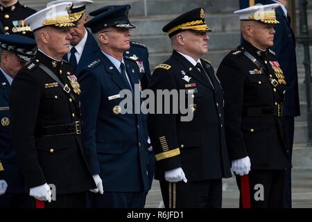 Members of the U.S. Joint Service Chiefs stand at attention outside Washington National Cathedral following the State Funeral of former president George H.W. Bush December 5, 2018 in Washington, DC. Bush, the 41st President, died in his Houston home at age 94. Standing from left to right are: Chairman of the Joint Chiefs Gen. Joseph Dunford, Vice Chairman Paul J. Selva, Army Chief General Mark A. Milley and Marine Corps Chief General Robert B. Neller. Stock Photo