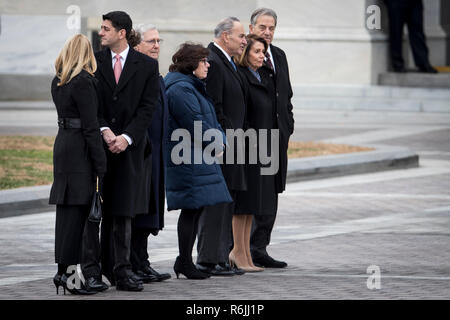 Congressional leadership including House Speaker Rep. Paul Ryan, Senate Majority Leader Sen. Mitch McConnell, Senate Minority Leader Sen. Chuck Schumer, House Minority Leader Rep. Nancy Pelosi and their respective spouses, gather on the East Front to view the remains of President George H.W. Bush be transported from the U.S. Capitol to the National Cathedral Wednesday December 5, 2018.  Credit: Sarah Silbiger / Pool via CNP | usage worldwide Stock Photo