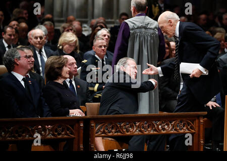 Former President George W. Bush shakes hands with former Sen. Alan Simpson, R-Wyo, after he spoke during the State Funeral for former President George H.W. Bush at the National Cathedral, Wednesday, Dec. 5, 2018, in Washington. Watching are Jeb Bush and Laura Bush. Credit: Alex Brandon / Pool via CNP | usage worldwide