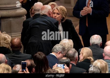 Former Secretary of State Hilary Clinton, right, greets former Vice President Joe Biden, left, before a State Funeral for former President George H.W. Bush at the National Cathedral, Wednesday, Dec. 5, 2018, in Washington.  Credit: Andrew Harnik / Pool via CNP | usage worldwide Stock Photo