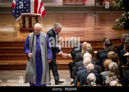 Presidential biographer Jon Meacham, second from left, shakes hands with former President George Bush after speaking during the State Funeral for former President George H.W. Bush at the National Cathedral, Wednesday, Dec. 5, 2018, in Washington. Credit: Andrew Harnik / Pool via CNP / MediaPunch Stock Photo