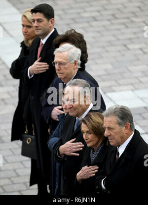 Congressional leaders from left to right, Speaker of the House Paul Ryan, R-Wis, Senate Majority Leader Mitch McConnell, R-Ky., Senate Minority Leader Chuck Schumer, D-NY, and House Minority Leader Nancy Pelosi, D-Calif., watch as a U.S. military honor guard carries the flag-draped casket of former U.S. President George H. W. Bush from the U.S. Capitol Wednesday, Dec. 5, 2018, in Washington. Credit: Win McNamee/Pool via CNP/MediaPunch Stock Photo