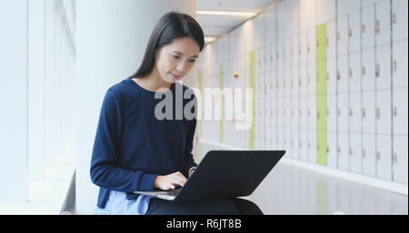 Student doing homework on laptop computer Stock Photo