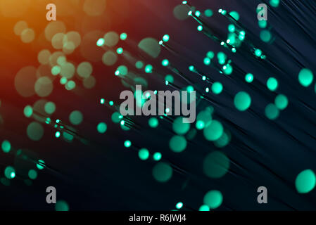 Fiber optics in green, close up with bokeh, warm lens flare Stock Photo