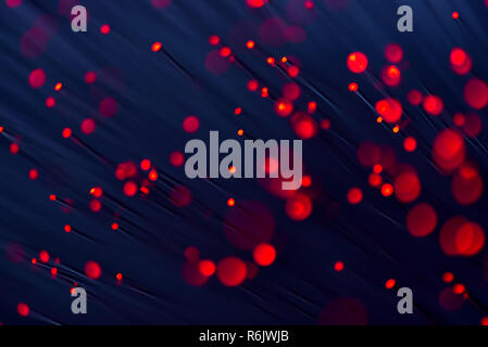 Fiber optics in red, close up with bokeh Stock Photo