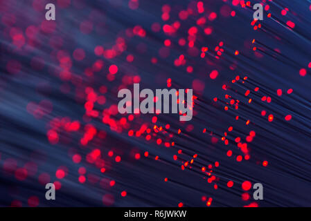 Fiber optics in red, close up with bokeh, warm lens flare Stock Photo