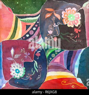 floral pattern on hand painted batik headscarf Stock Photo