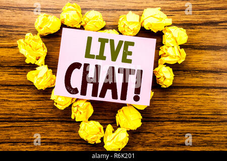 Word, writing Live Chat . Business concept for Communication Livechat written on sticky note paper on the wooden background. Stock Photo