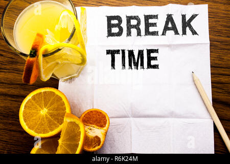 Conceptual text caption showing Break Time. Concept for Stop Pause From Work Workshop written on tissue paper on the wooden background with pen healthy juice and orange fruit in the restaurant Stock Photo