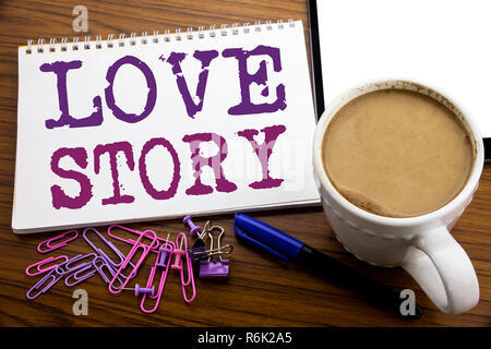 Hand writing text caption inspiration showing Love Story. Business concept for Loving Someone Heart  written on note paper on the wooden background with coffee and pen Stock Photo