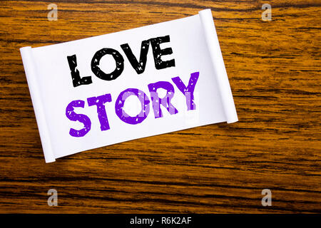 Word, writing Love Story. Business concept for Loving Someone Heart  written on sticky note paper on the wooden wood structure visible background. Stock Photo