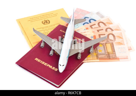 vaccination card and passport with airplane Stock Photo