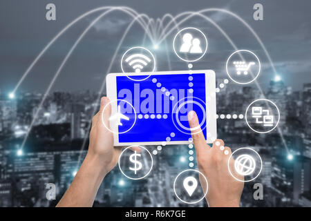 Hand holding digital tablet with smart technology icon and Tokyo city with network connection concept, Tokyo smart city and wireless communication net Stock Photo