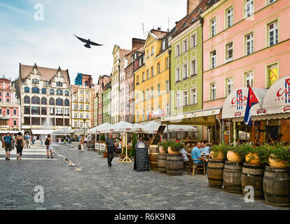 WROCLAW POLAND -August 18 2013: People visit Rynek (Market Square) in Wroclaw. Wroclaw is the 4th largest city in Poland with 632067 people (2013). Stock Photo