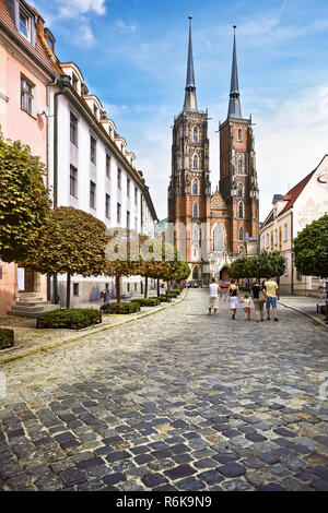 WROCLAW, POLAND - August 18, 2013: View at The Cathedral of St. John the Baptist in the Ostrow Tumski district of Wroclaw. Pedestrians visible. The be Stock Photo