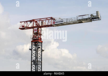 Rotterdam, The Netherlands, August 28, 2018: view of the top section of a tower crane under construction with some horizontal sections still to be add Stock Photo