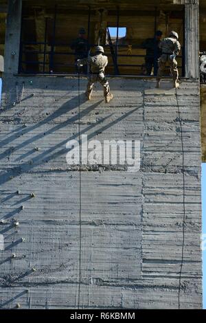 Greek paratroopers with 1st Paratrooper Commando Brigade, Greek Army conduct rappelling training for Sky Soldiers from B Company, 1st Battalion, 503rd Infantry Regiment, 173rd Airborne Brigade, May 20, 2017 in Camp Rentina, Greece as a part of Exercise Bayonet Minotaur 2017. Bayonet-Minotaur is a bilateral training exercise between U.S. Soldiers assigned to 173rd Airborne Brigade and the Greek Armed Forces, focused on enhancing NATO operational standards and developing individual technical skills. Stock Photo