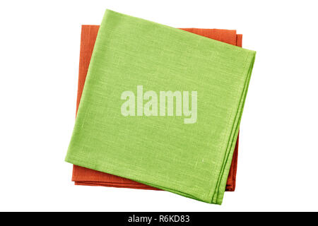 Stack of pale green and red folded napkins isolated on white background Stock Photo