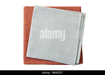 Stack of pale gray end brown napkins isolated on white background Stock Photo