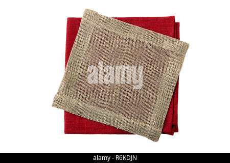 Stack of folded red and jute napkins on white Stock Photo