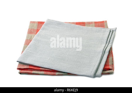 Folded gray and red-checkered textile napkins stacked on white Stock Photo