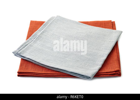 Folded gray and brown textile napkins stacked on white background Stock Photo