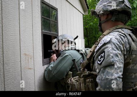 Soldiers of the 753rd Explosive Ordnance Disposal (EOD) of Kingwood, W.Va., and members of the West Virginia State Police Bomb Squad participated in a Raven's Challenge that took place at Camp Dawson, Kingwood, from May 21-26, 2017. Raven's Challenge is an annual, interagency, counter IED exercise that incorporates scenarios focused on interoperability capabilities between public safety bomb squads and military EOD units in operational domestic type IED environments. The exercise also provided international participation. Stock Photo