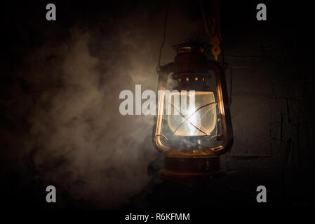 vintage lantern on a dark background smoke Stock Photo