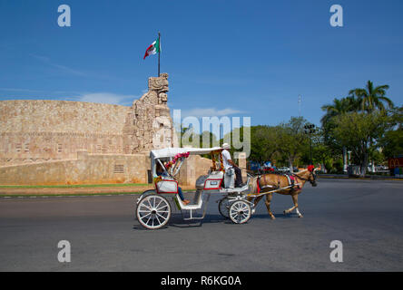 Tourist in Horse Carriage, Monument to the Patria (Homeland), Sculpted by Romulo Rozo, Merida, Yucatan, Mexico Stock Photo