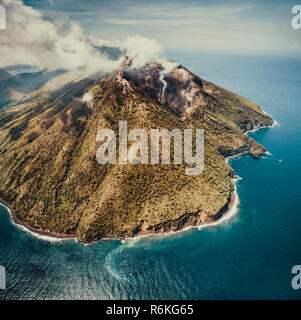 Overview of active Indonesia volcano. Aerial drone shot. Overwhelming ...