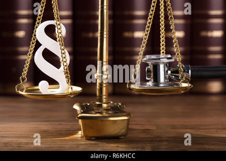 Paragraph Symbol And Stethoscope On Justice Scale Stock Photo