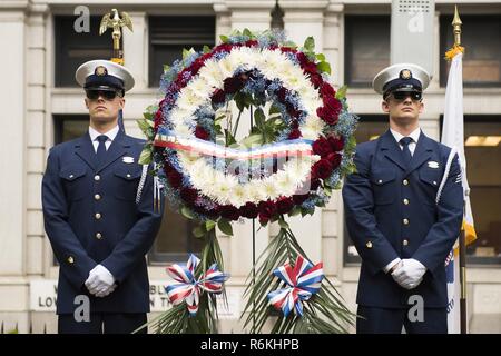 Member of the U.S. Coast Guard Silent Drill Team stand at attention at a memorial wreath-laying ceremony to honor Coast Guard founder, Alexander Hamilton, at his grave at Trinity Church in New York City, May 26, 2017. Cast members Lexi Lawson (Eliza Hamilton) and Brandon Victor Dixon (Aaron Burr) of the esteemed Broadway musical, Hamilton also attended and paid their respect to the shared namesake of the Coast Guard cutter and the musical. U.S. Coast Guard Stock Photo
