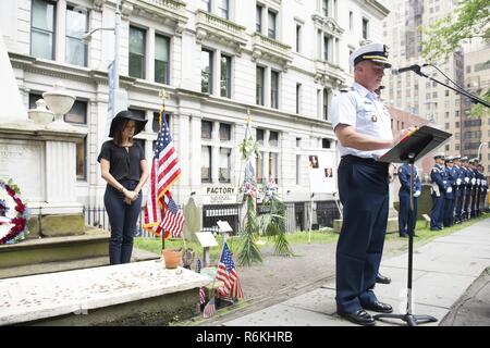 Capt. Scott Clendenin, the commanding officer of the Coast Guard Cutter Hamilton, shares remarks to honor Coast Guard founder, Alexander Hamilton, during a memorial wreath-laying ceremony at his gravesite at Trinity Church, in New York City, May 26, 2017. Cast members Lexi Lawson (Eliza Hamilton) and Brandon Victor Dixon (Aaron Burr) of the esteemed Broadway musical, Hamilton also attended and paid their respect. U.S. Coast Guard Stock Photo