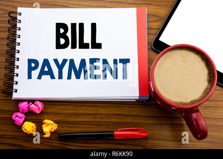 Handwritten text showing Bill Payment. Business concept writing Billing Pay Costs Written on notepad note paper, old black wooden background in office view with pen coffee and tablet Stock Photo