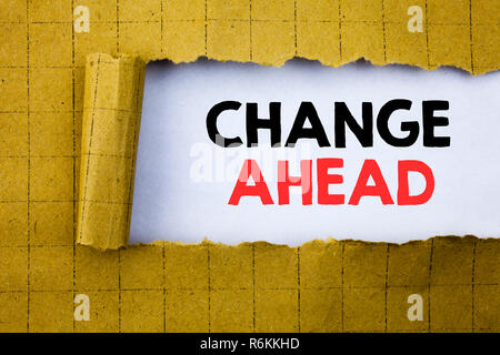 Change Ahead Red Word. Business concept for Future Changes written on white paper on the yellow folded paper. Stock Photo