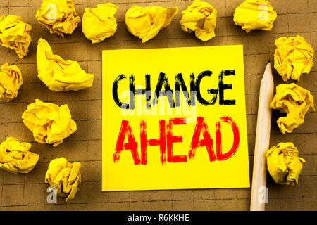 Change Ahead Red Word. Business concept for Future Changes written on sticky note paper on the vintage background. Folded yellow papers on the background Stock Photo