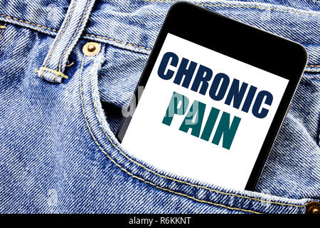 Conceptual hand writing text caption inspiration showing Chronic Pain. Business concept for Feeling Bad ill Care Written phone mobile phone, cellphone placed in the man front jeans pocket. Stock Photo