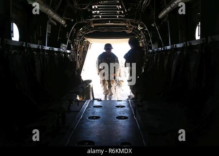 Marines with Marine Medium Tiltrotor Squadron (VMM) 363 extract Marines with 3rd Marine Regiment while conducting a long range raid simulation during Integrated Training Exercise (ITX) 3-17 at Marine Corps Air Station Yuma, Arizona, May 27. ITX is a combined-arms exercise enabling Marines across 3rd Marine Aircraft Wing to operate as an aviation combat element integrated with ground and logistics combat elements as a Marine air-ground task force. More than 650 Marines and 27 aircraft with 3rd MAW are supporting ITX 3-17. Stock Photo