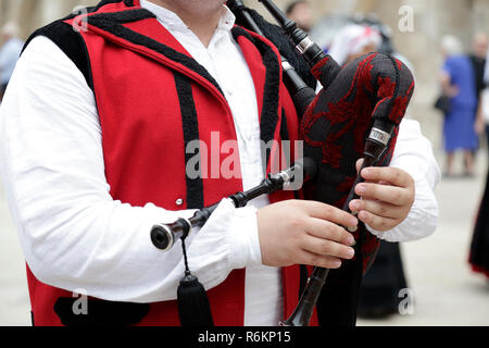 Detail of a man playing the Galician bagpipe, dressed in a traditional costume of Galicia, northwestern Spain Stock Photo